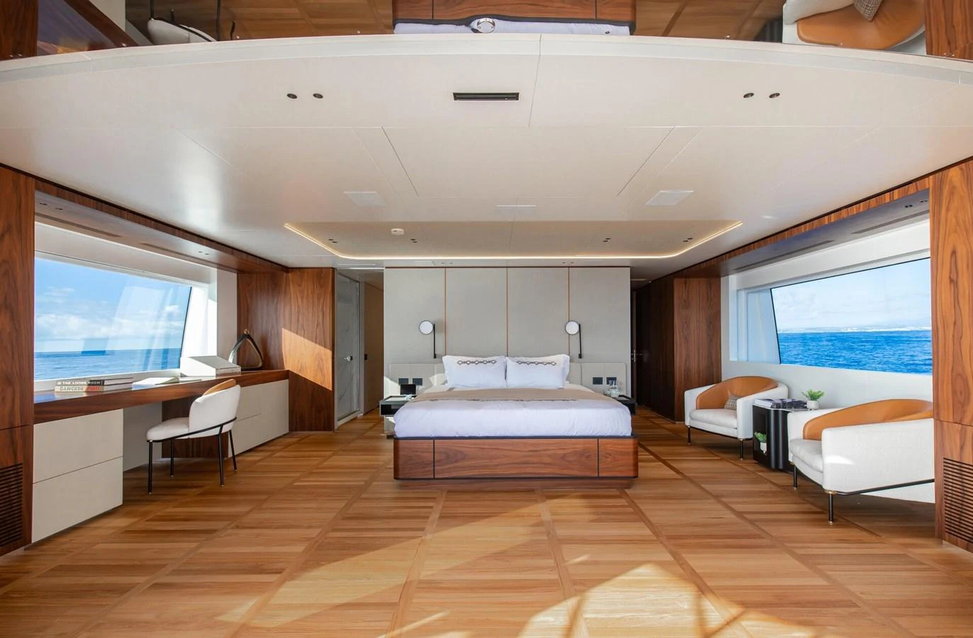 The master stateroom features a spacious layout with large windows offering stunning ocean views. aboard CADA DIA Yacht for Sale
