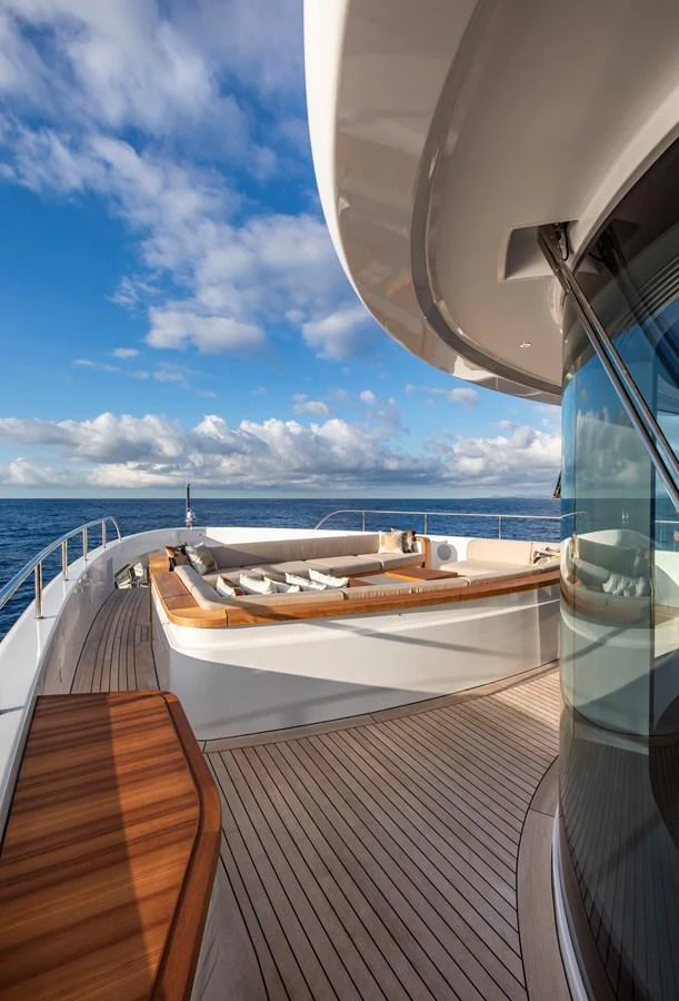 The yacht's foredeck features a luxurious lounging area with stunning ocean views. aboard CADA DIA Yacht for Sale