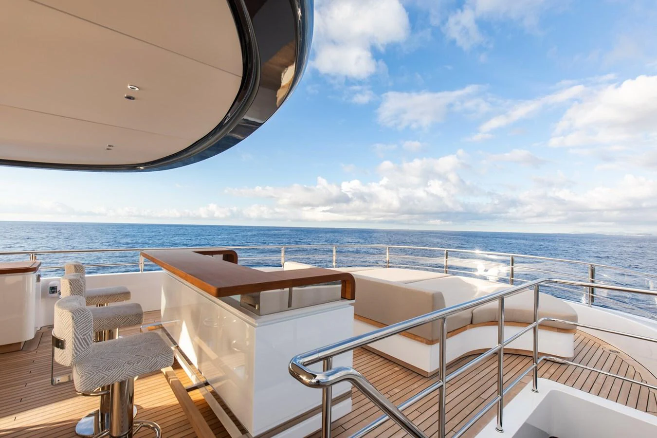The aft deck offers a luxurious outdoor seating area with stunning ocean views. aboard CADA DIA Yacht for Sale