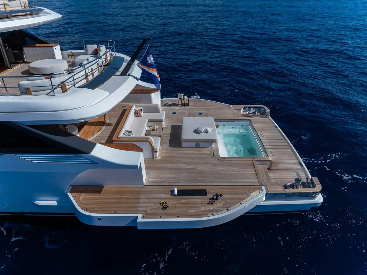The yacht's aft deck features a luxurious pool and spacious lounging areas, perfect for relaxation on the open sea. aboard CADA DIA Yacht for Sale