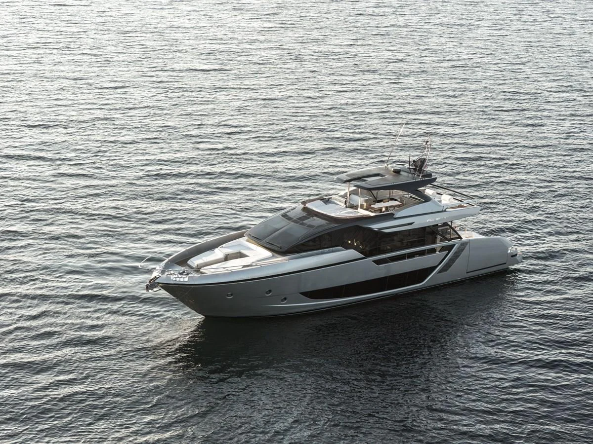 A sleek and modern yacht glides gracefully on calm waters, showcasing its elegant design. aboard CREA Yacht for Sale