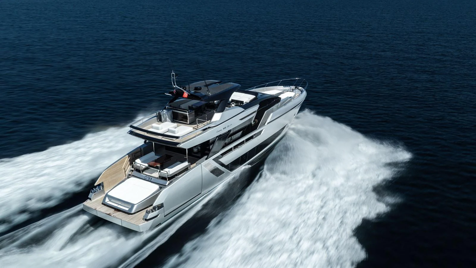 A sleek and modern yacht glides swiftly across the open water, showcasing its elegant design and powerful performance. aboard CREA Yacht for Sale