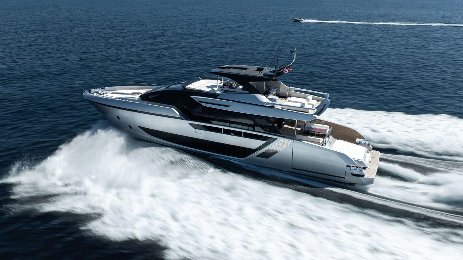 A sleek and modern yacht cruises swiftly through the open water, showcasing its elegant design and powerful performance. aboard CREA Yacht for Sale