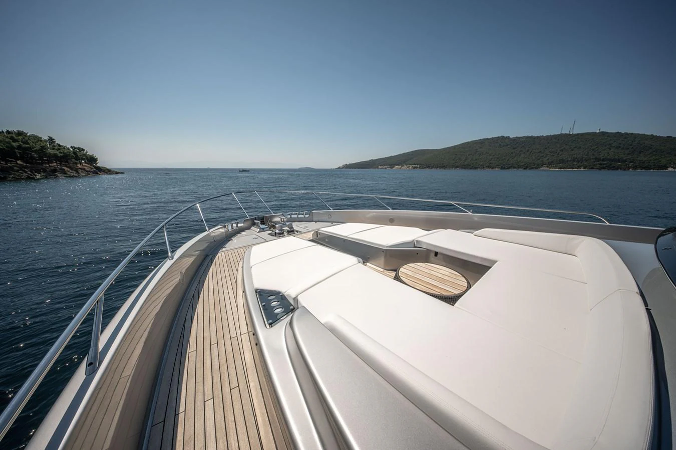 The foredeck features luxurious sun pads and stunning views of the surrounding waters. aboard CREA Yacht for Sale