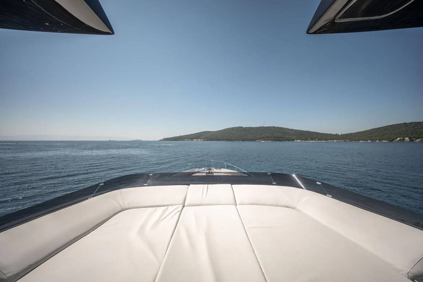 The yacht's bow offers a spacious and inviting sunbathing area with a stunning view of the open sea. aboard CREA Yacht for Sale