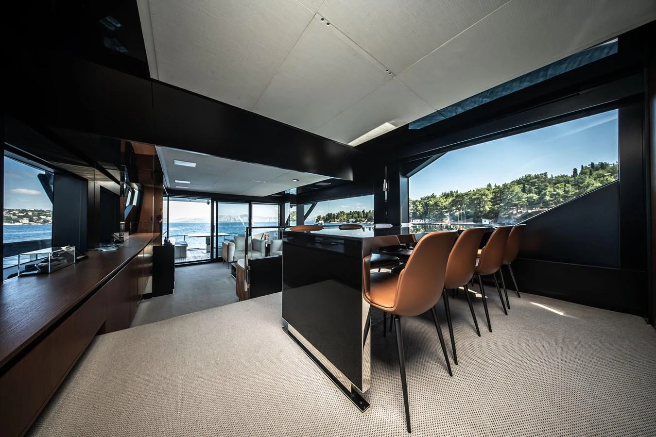 The yacht's dining area offers panoramic views and modern furnishings, creating an elegant and inviting space. aboard CREA Yacht for Sale