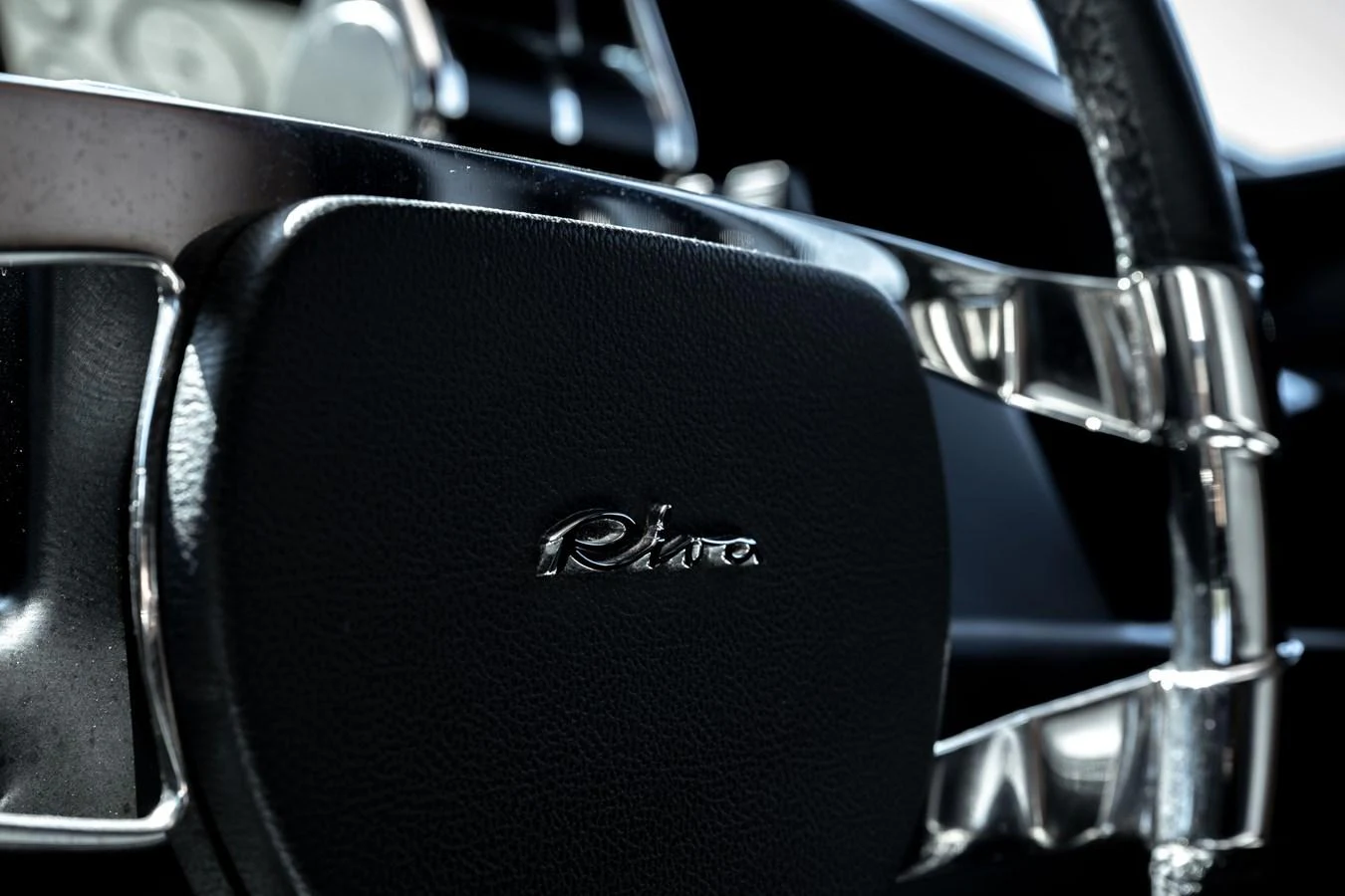 Close-up of the yacht's steering wheel showcasing luxurious craftsmanship. aboard CREA Yacht for Sale