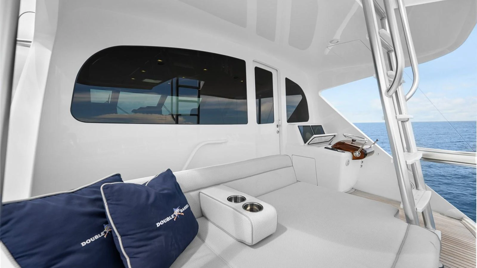 The flybridge offers a comfortable seating area with a view of the ocean. aboard DOUBLE BARREL Yacht for Sale