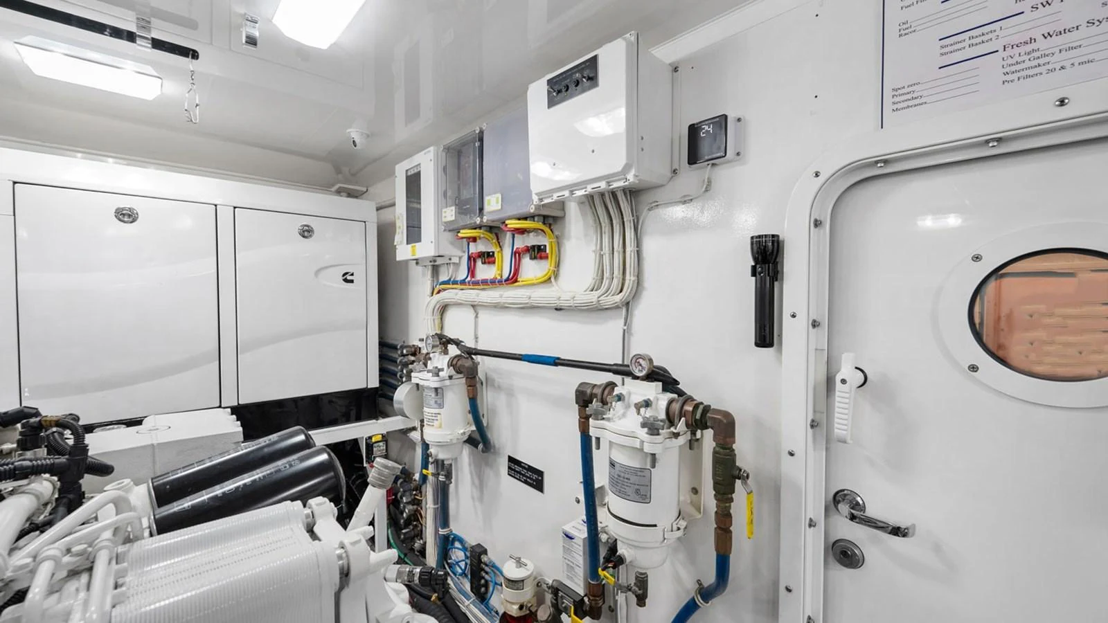 The image showcases the clean and well-organized engine room of the yacht. aboard DOUBLE BARREL Yacht for Sale