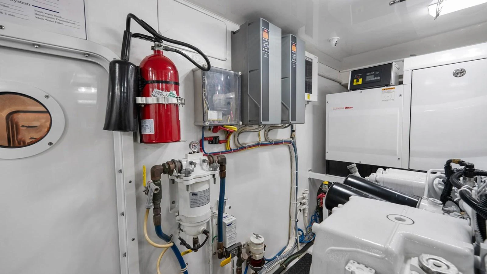 The engine room is equipped with essential machinery and safety equipment. aboard DOUBLE BARREL Yacht for Sale