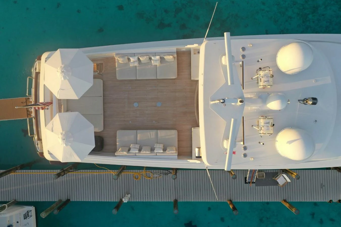 The sundeck offers a luxurious space with ample seating and shade, perfect for relaxation. aboard UKARA Yacht for Sale