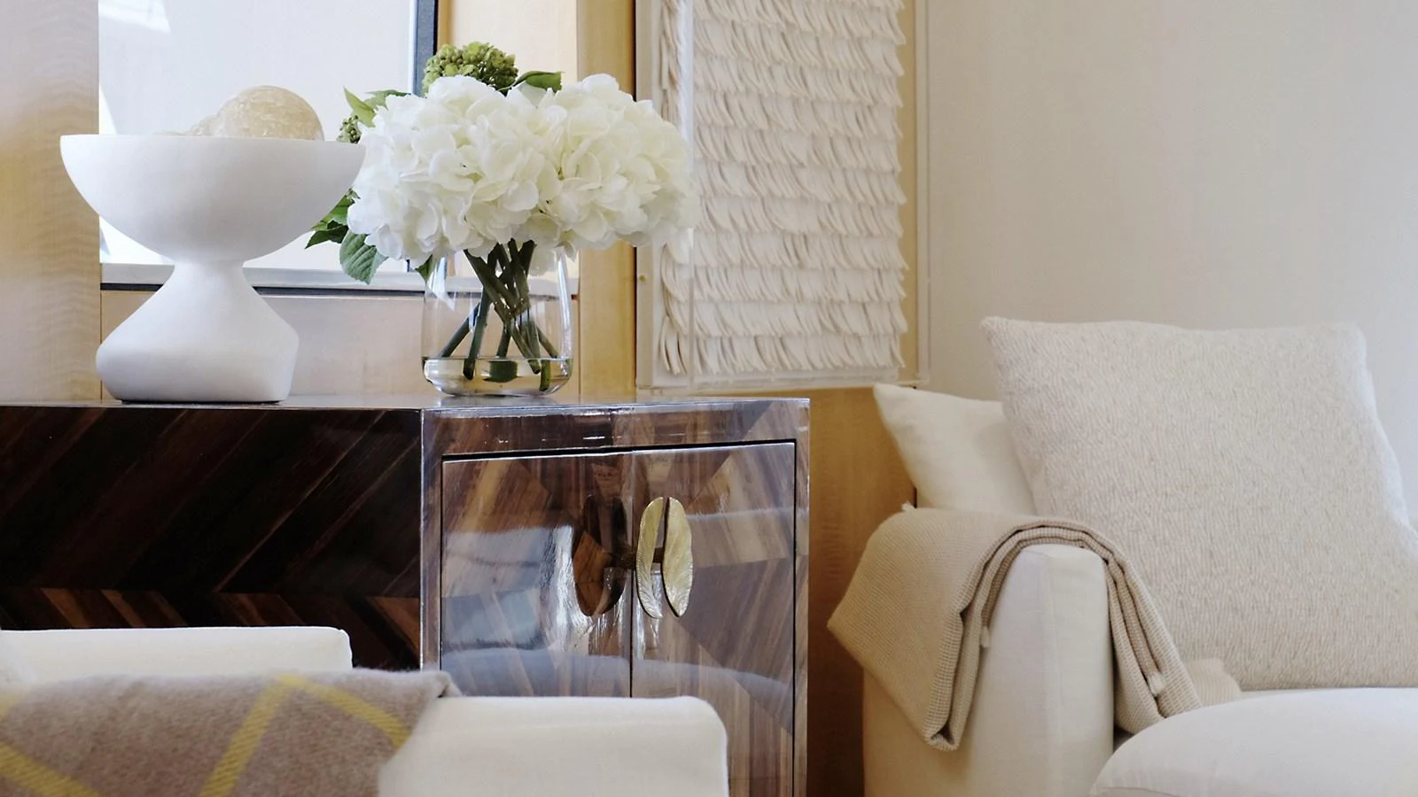 A cozy and elegant interior space featuring a comfortable armchair and tasteful decor. aboard UKARA Yacht for Sale