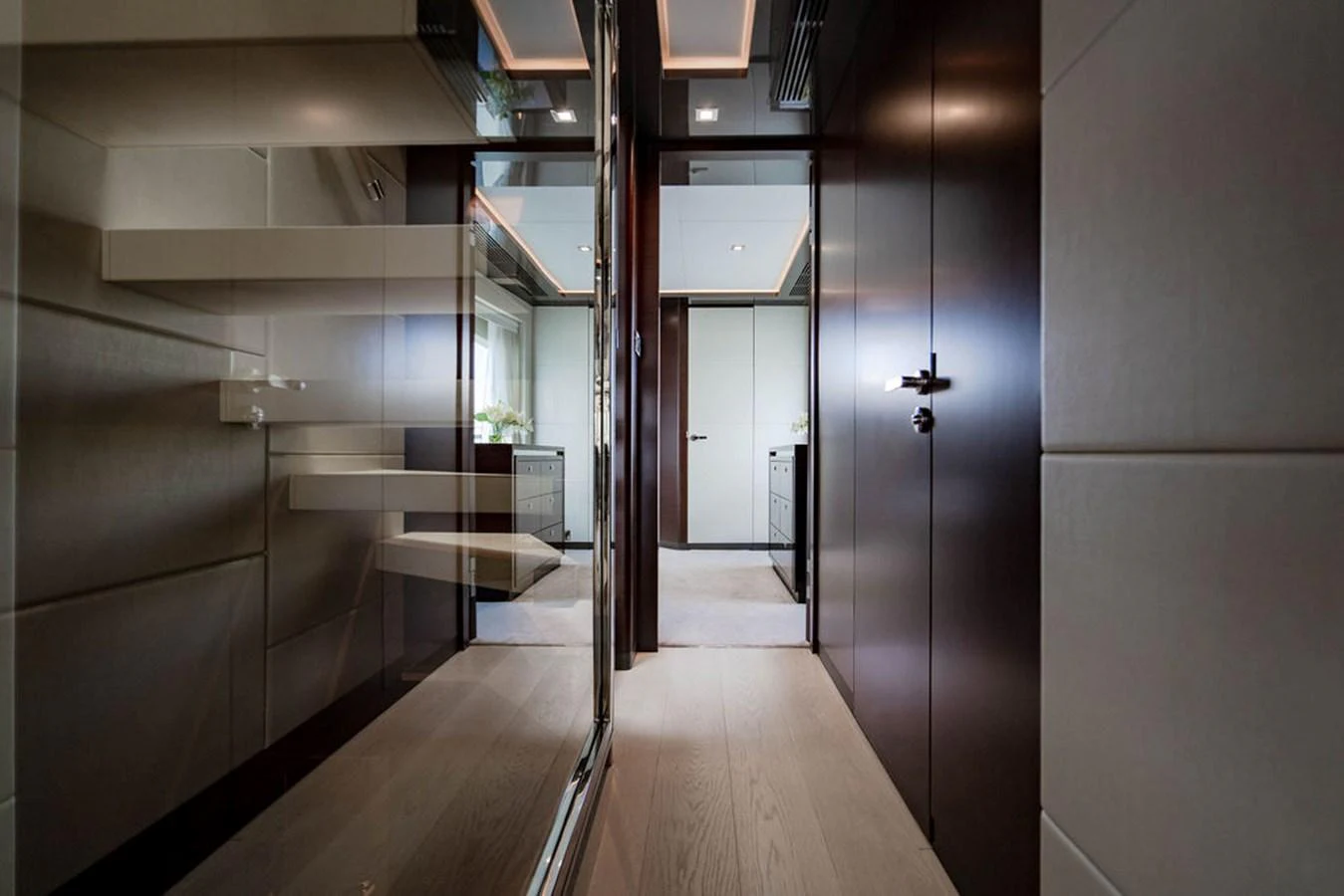 The image showcases a sleek and modern hallway inside the yacht, featuring elegant finishes and contemporary design. aboard M/Y 12 Yacht for Sale