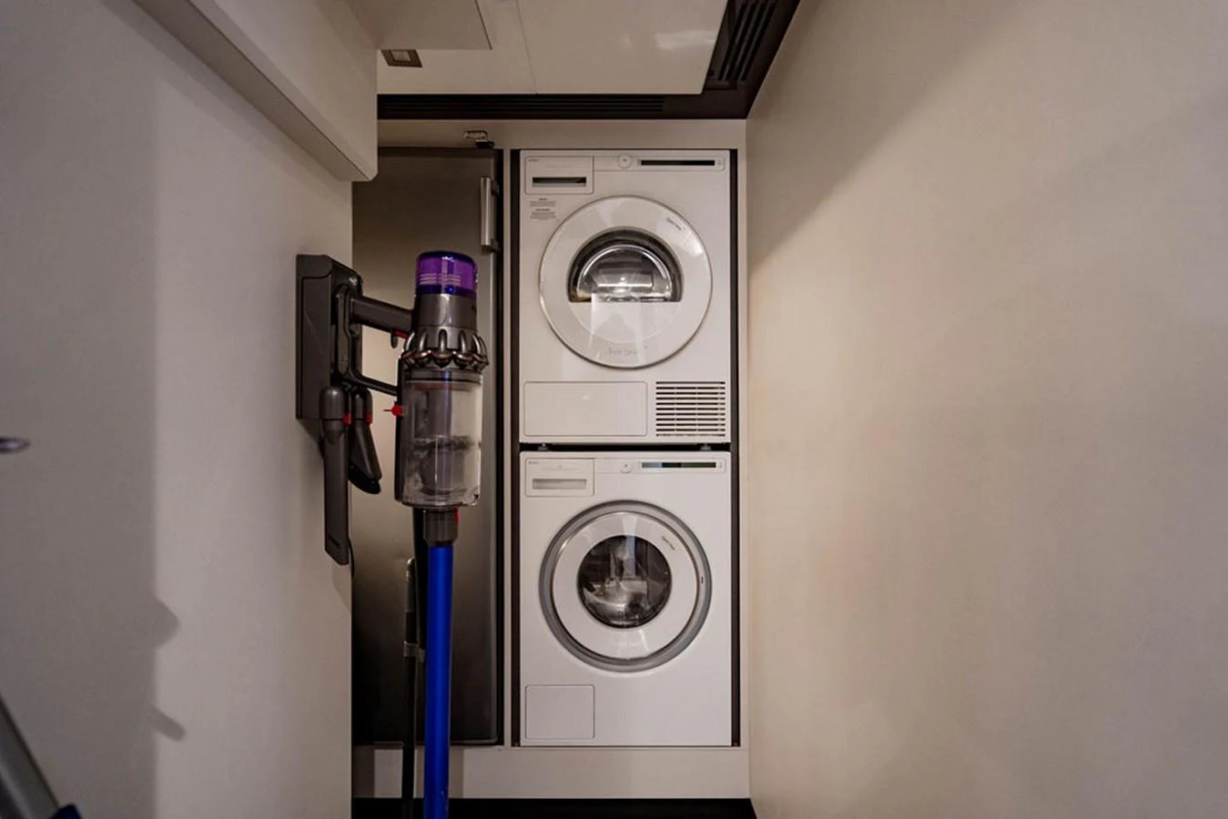 The yacht features a convenient laundry area with modern appliances. aboard M/Y 12 Yacht for Sale