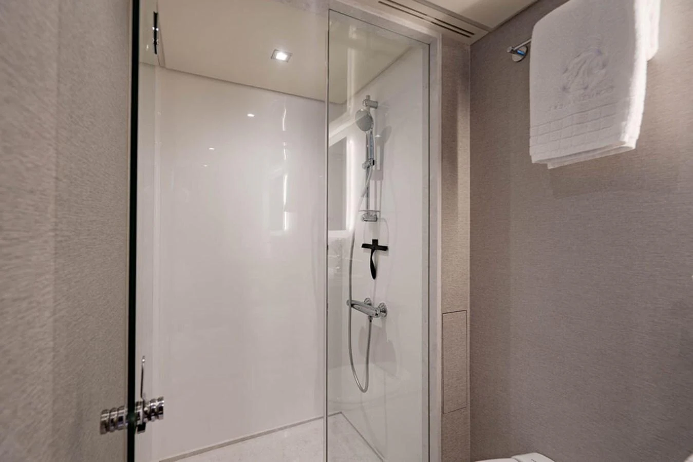 The yacht's bathroom features a modern glass-enclosed shower and elegant fixtures. aboard M/Y 12 Yacht for Sale