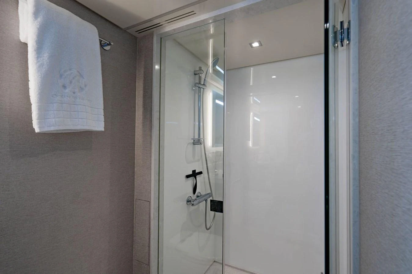 The yacht's bathroom features a sleek, modern shower with glass doors and elegant fixtures. aboard M/Y 12 Yacht for Sale