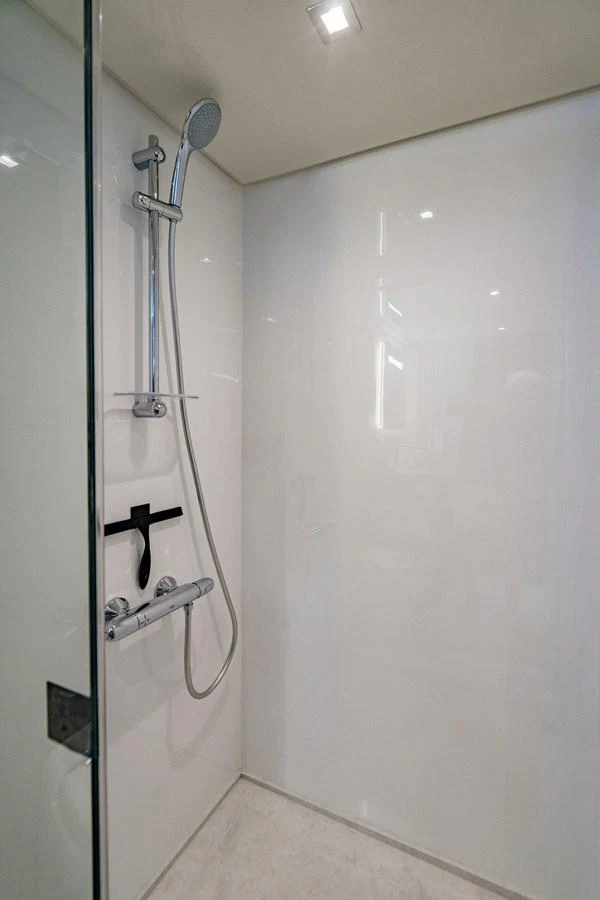 A sleek and modern shower area with minimalist fixtures. aboard M/Y 12 Yacht for Sale