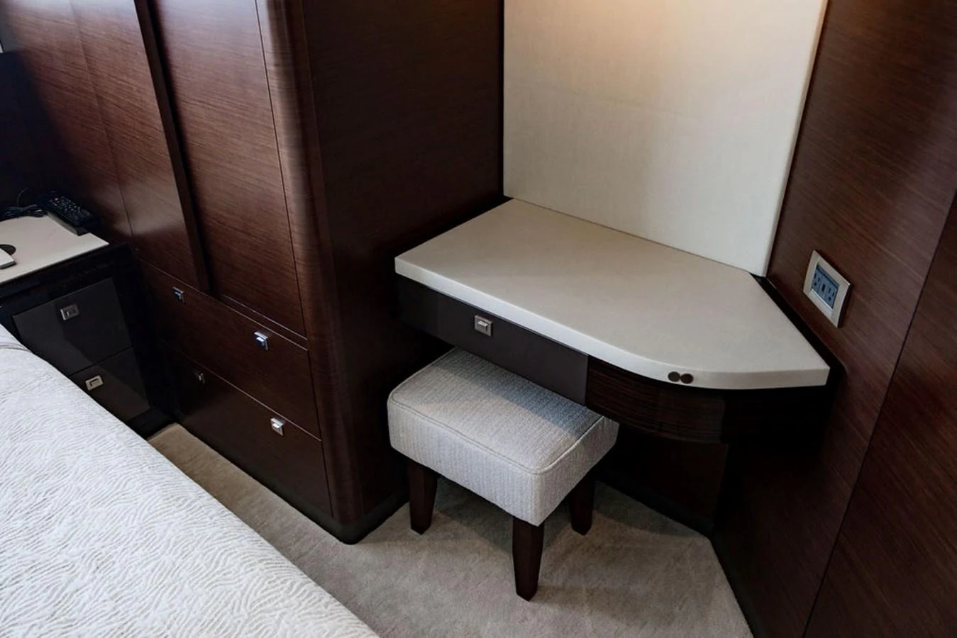 A cozy corner of the yacht's interior featuring a small desk and stool. aboard M/Y 12 Yacht for Sale