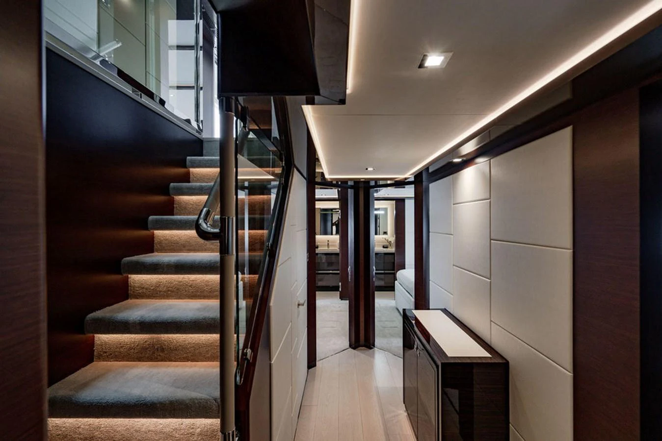 A luxurious hallway with modern lighting and a staircase leading to the upper deck. aboard M/Y 12 Yacht for Sale