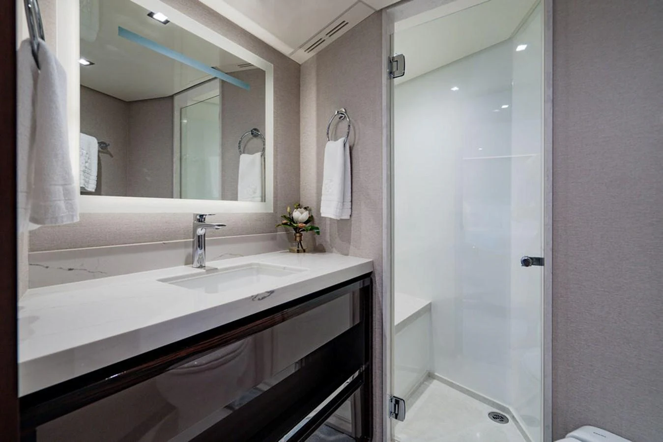 A sleek and modern bathroom with a spacious shower and elegant fixtures. aboard M/Y 12 Yacht for Sale