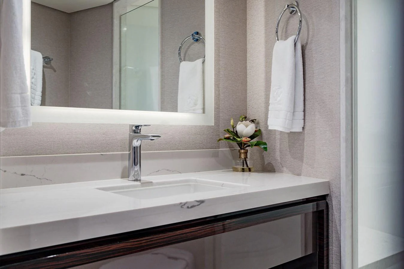 The yacht's bathroom features a sleek, modern sink with elegant fixtures and a well-lit mirror. aboard M/Y 12 Yacht for Sale
