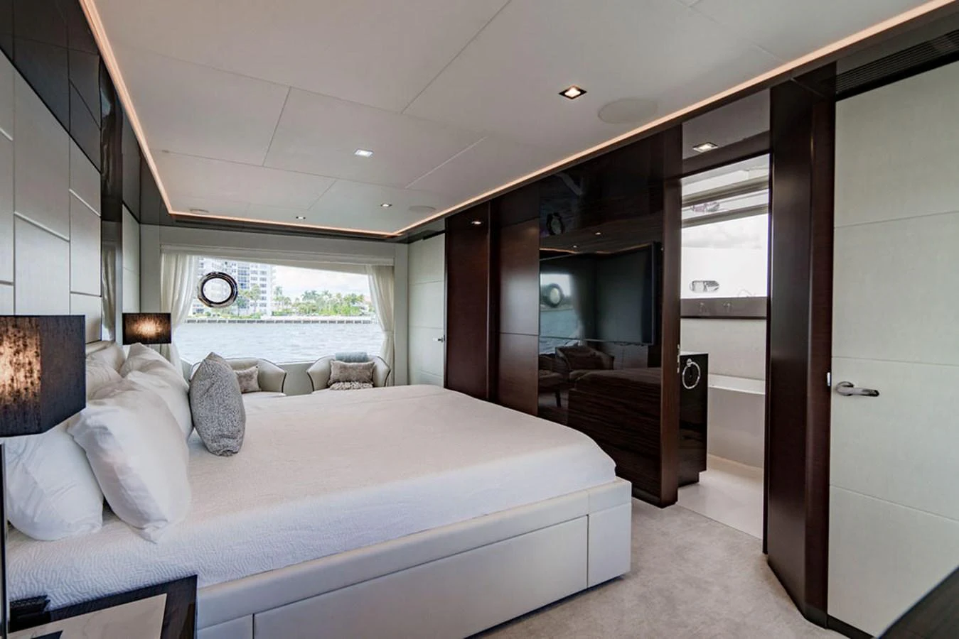 The master stateroom features a luxurious bed with elegant decor and ample natural light. aboard M/Y 12 Yacht for Sale