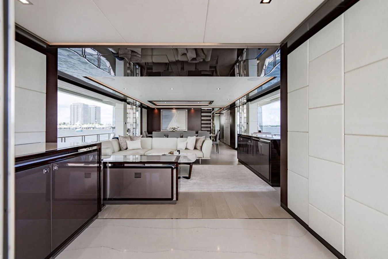 The yacht's salon features a spacious and modern design with luxurious seating and ample natural light. aboard M/Y 12 Yacht for Sale