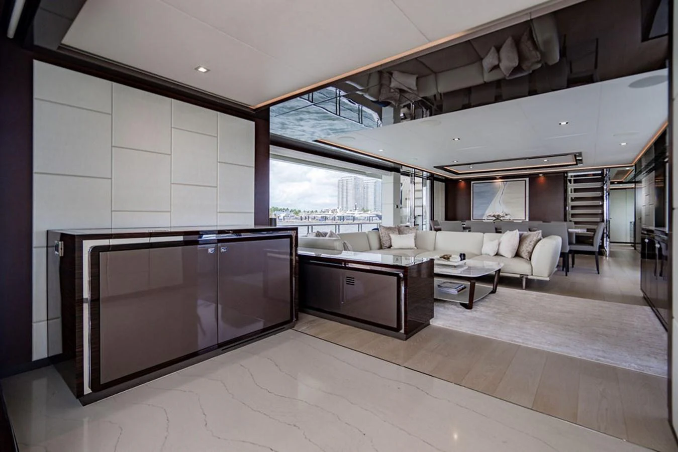 The salon features a spacious and modern design with luxurious seating and elegant decor. aboard M/Y 12 Yacht for Sale