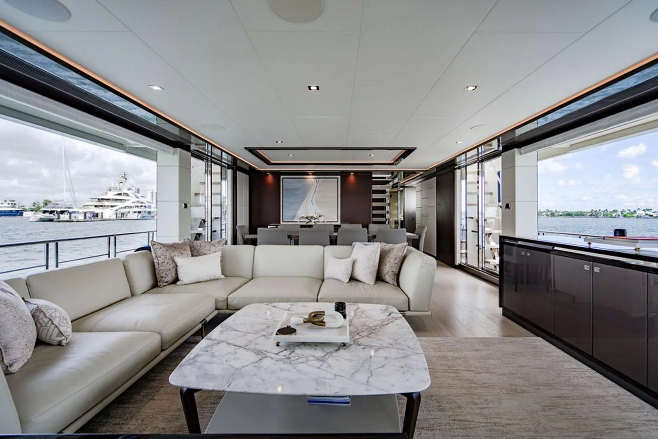 The salon features a spacious and elegant seating area with panoramic views of the water. aboard M/Y 12 Yacht for Sale