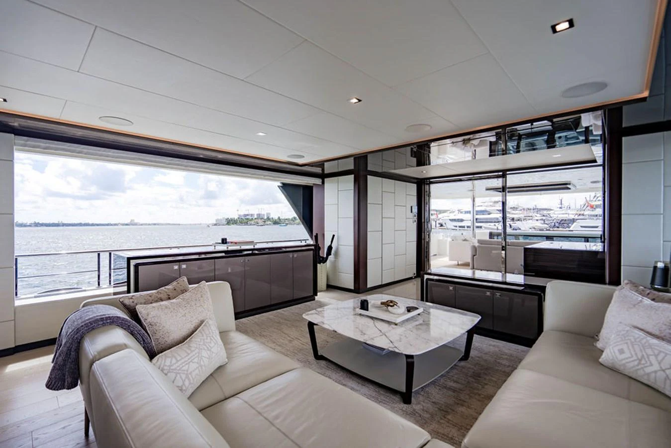 The salon offers a spacious and elegant area with comfortable seating and panoramic views. aboard M/Y 12 Yacht for Sale