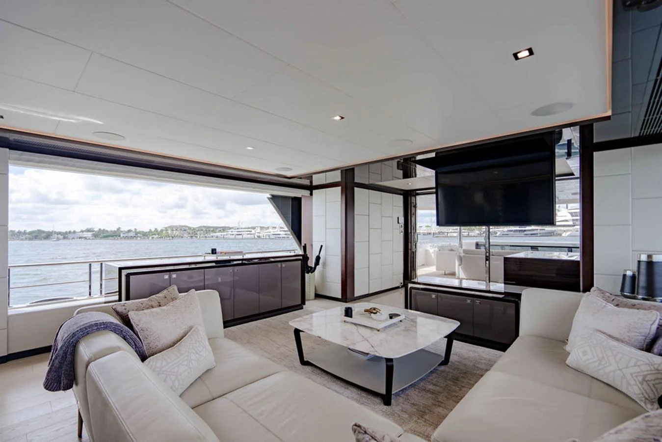 The spacious salon offers a luxurious and comfortable setting with ample seating and a stunning view of the water. aboard M/Y 12 Yacht for Sale