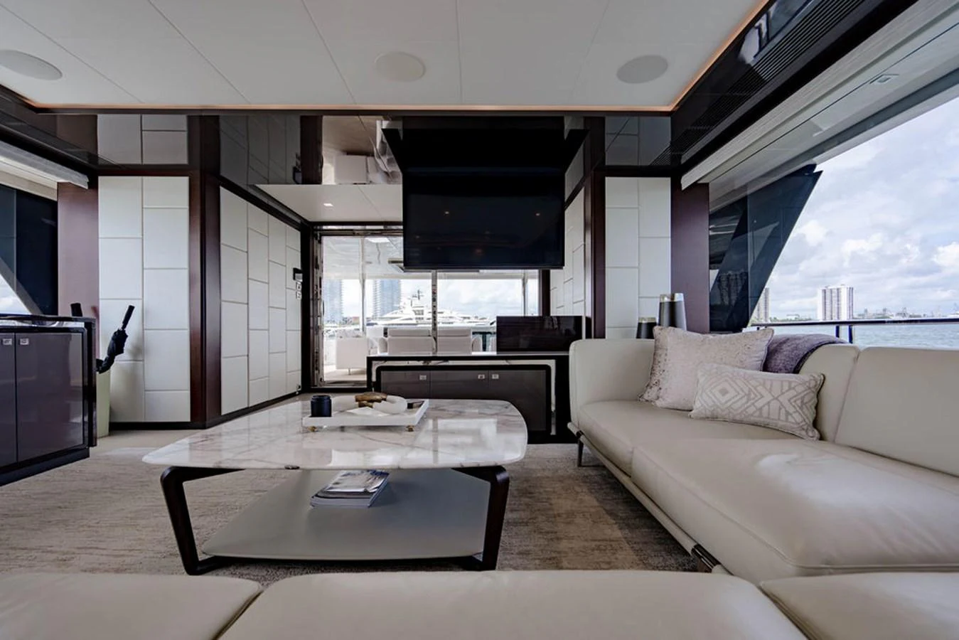 The salon offers a luxurious and spacious seating area with modern decor and expansive views. aboard M/Y 12 Yacht for Sale