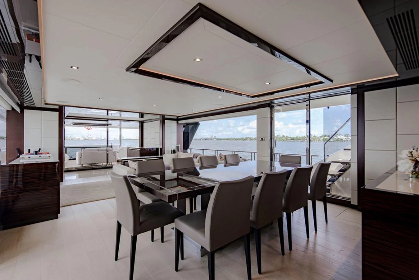 The yacht's dining area features a modern, elegant design with ample seating and large windows offering stunning views. aboard M/Y 12 Yacht for Sale