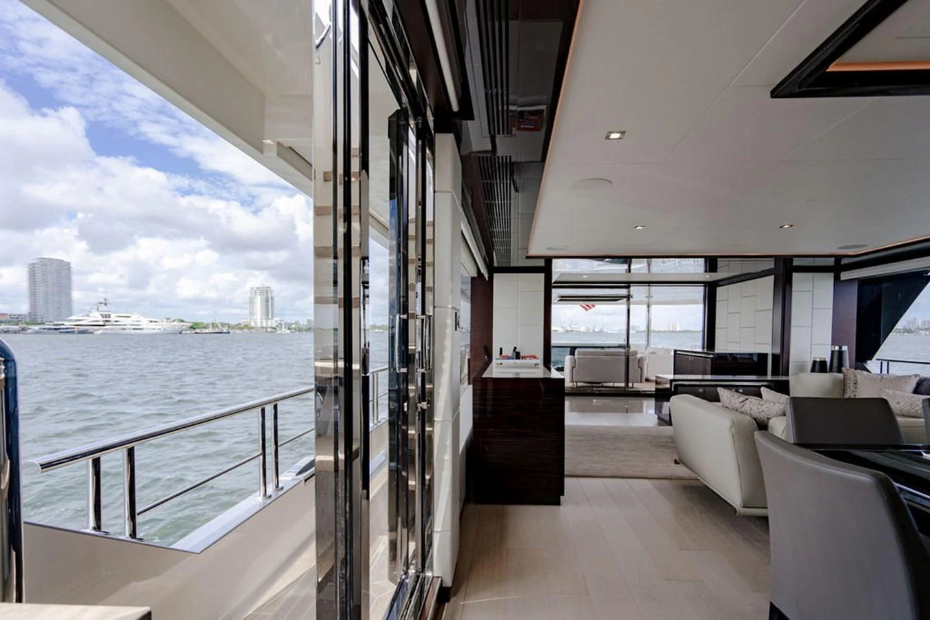 The yacht's salon offers a luxurious and spacious area with large windows providing stunning views of the water. aboard M/Y 12 Yacht for Sale