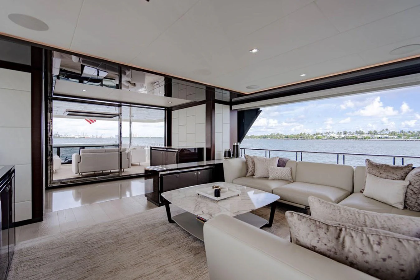 The salon offers a spacious and elegant seating area with panoramic views of the water. aboard M/Y 12 Yacht for Sale