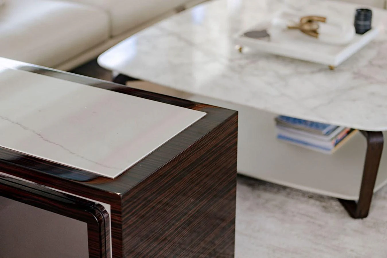 The image showcases a modern and elegant interior with a marble coffee table and luxurious furnishings. aboard M/Y 12 Yacht for Sale