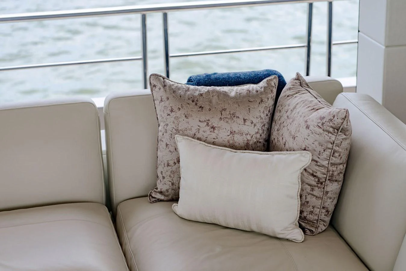 A cozy seating area with plush cushions offers a comfortable spot to relax while enjoying the view. aboard M/Y 12 Yacht for Sale