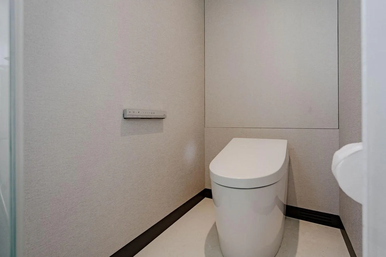 The yacht's head features a modern, sleek toilet with minimalist design. aboard M/Y 12 Yacht for Sale