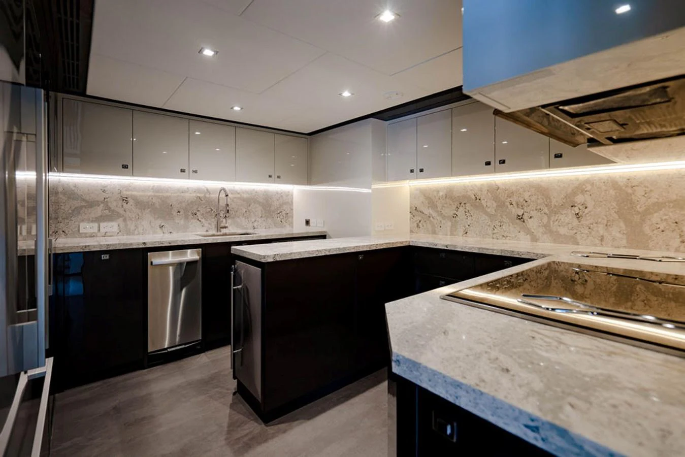 The yacht's galley features modern appliances and sleek countertops, creating a sophisticated culinary space. aboard M/Y 12 Yacht for Sale