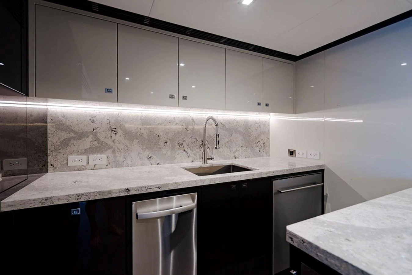 The modern galley features sleek cabinetry and high-end appliances. aboard M/Y 12 Yacht for Sale