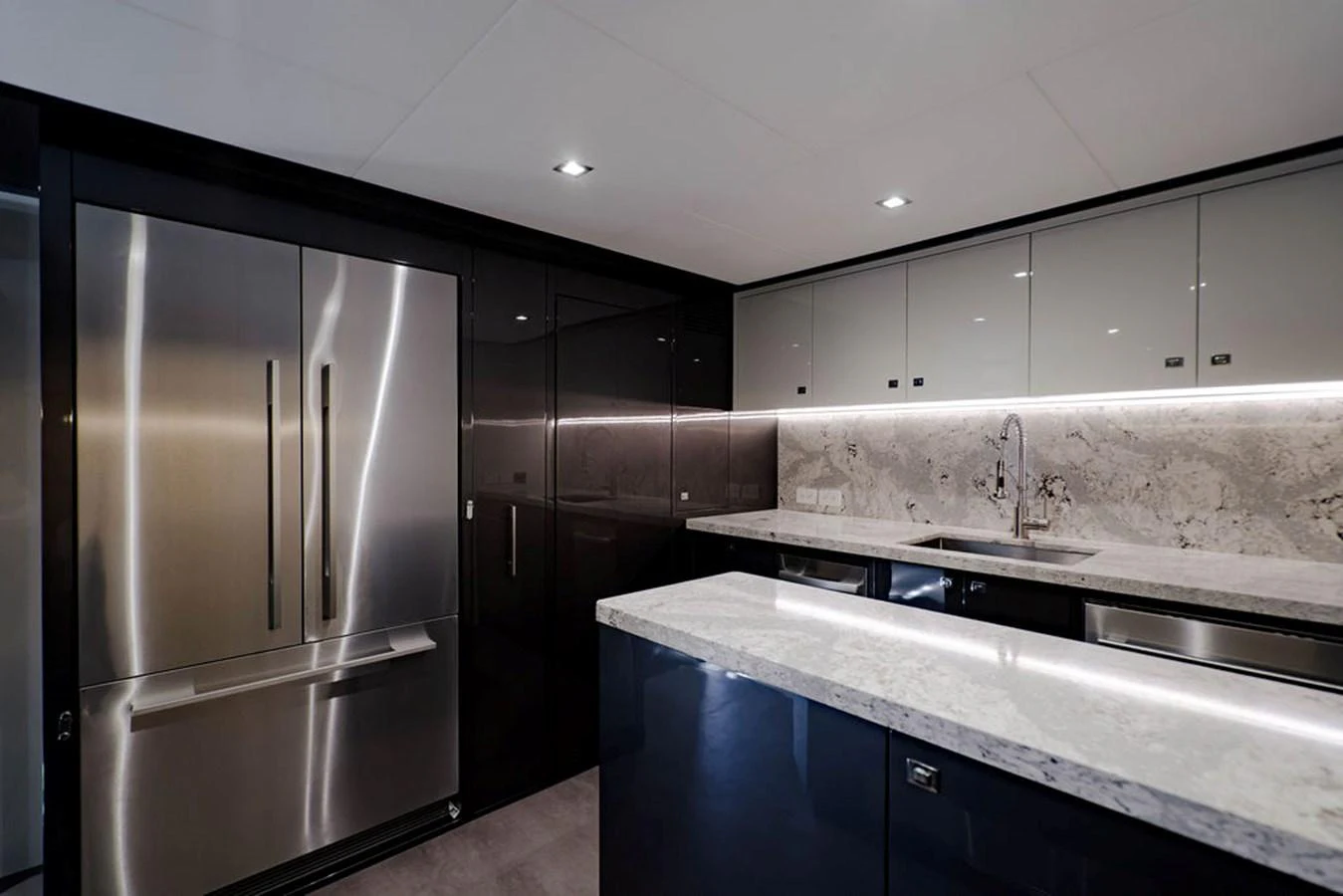 The yacht's galley features modern appliances and sleek finishes, perfect for gourmet cooking. aboard M/Y 12 Yacht for Sale