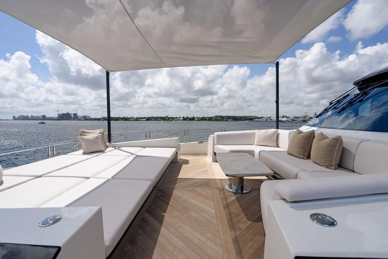 The sundeck offers a luxurious lounging area with ample seating and stunning ocean views. aboard M/Y 12 Yacht for Sale