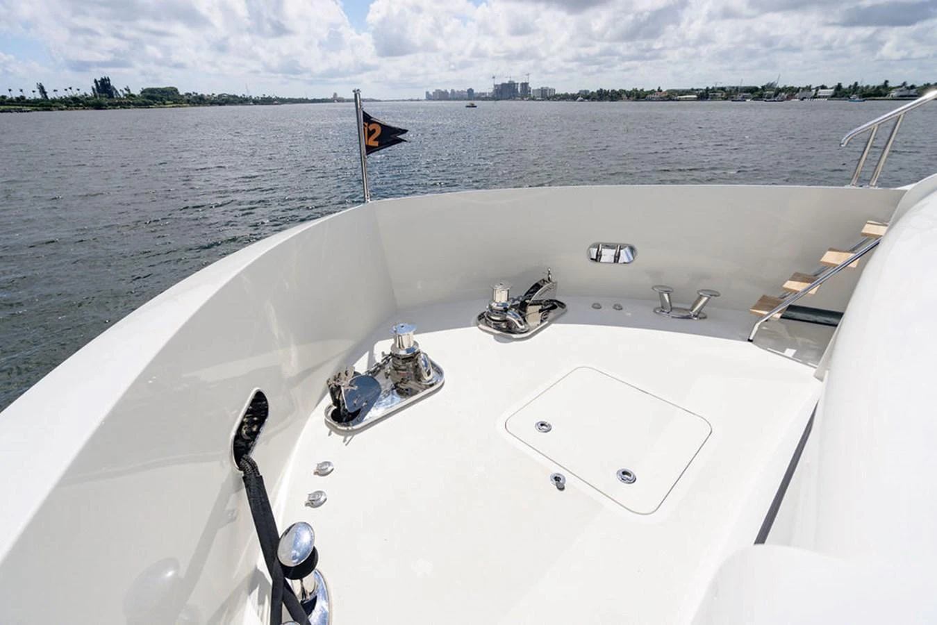 The bow of the yacht offers a spacious and clean area with polished fixtures and a serene view of the water. aboard M/Y 12 Yacht for Sale