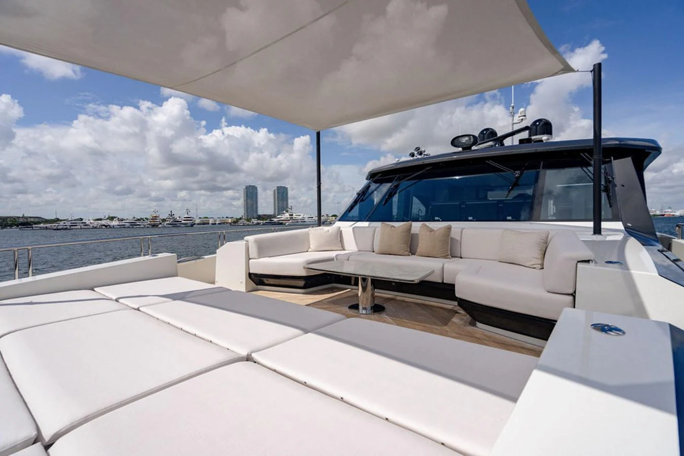 The flybridge offers a spacious and comfortable seating area with a sunshade, perfect for relaxation and socializing. aboard M/Y 12 Yacht for Sale