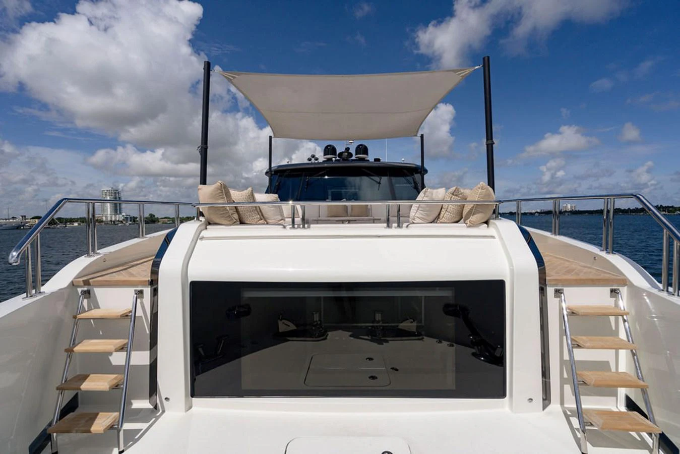 The aft deck features a spacious lounging area with plush cushions and a sleek, modern design. aboard M/Y 12 Yacht for Sale