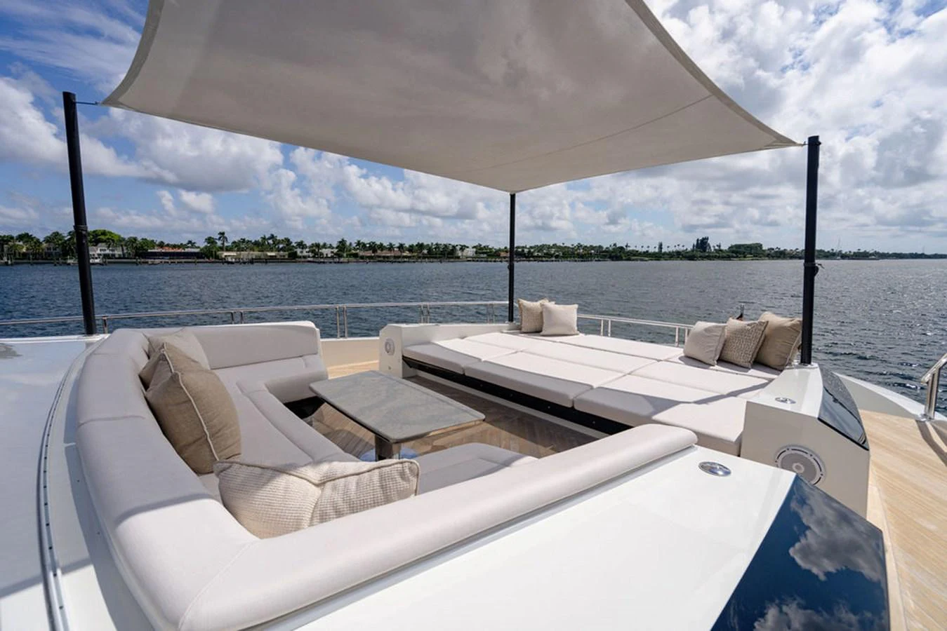 The sundeck offers luxurious lounging with ample seating and a shaded area for relaxation. aboard M/Y 12 Yacht for Sale