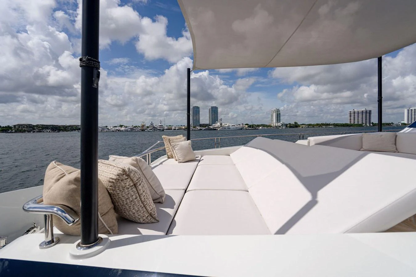 The sundeck offers a spacious and comfortable lounging area with stunning views of the water and skyline. aboard M/Y 12 Yacht for Sale