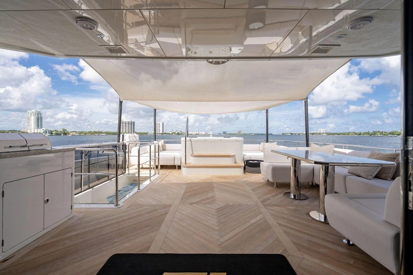 The aft deck offers a spacious and elegant outdoor living area with stunning views. aboard M/Y 12 Yacht for Sale