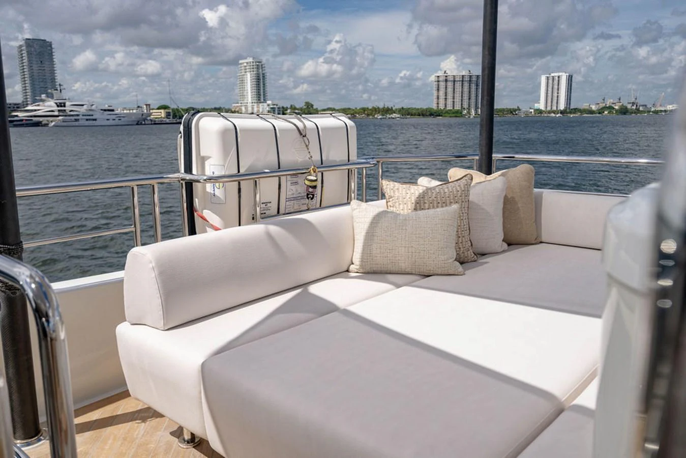 The sundeck offers a comfortable lounging area with plush seating and scenic views. aboard M/Y 12 Yacht for Sale