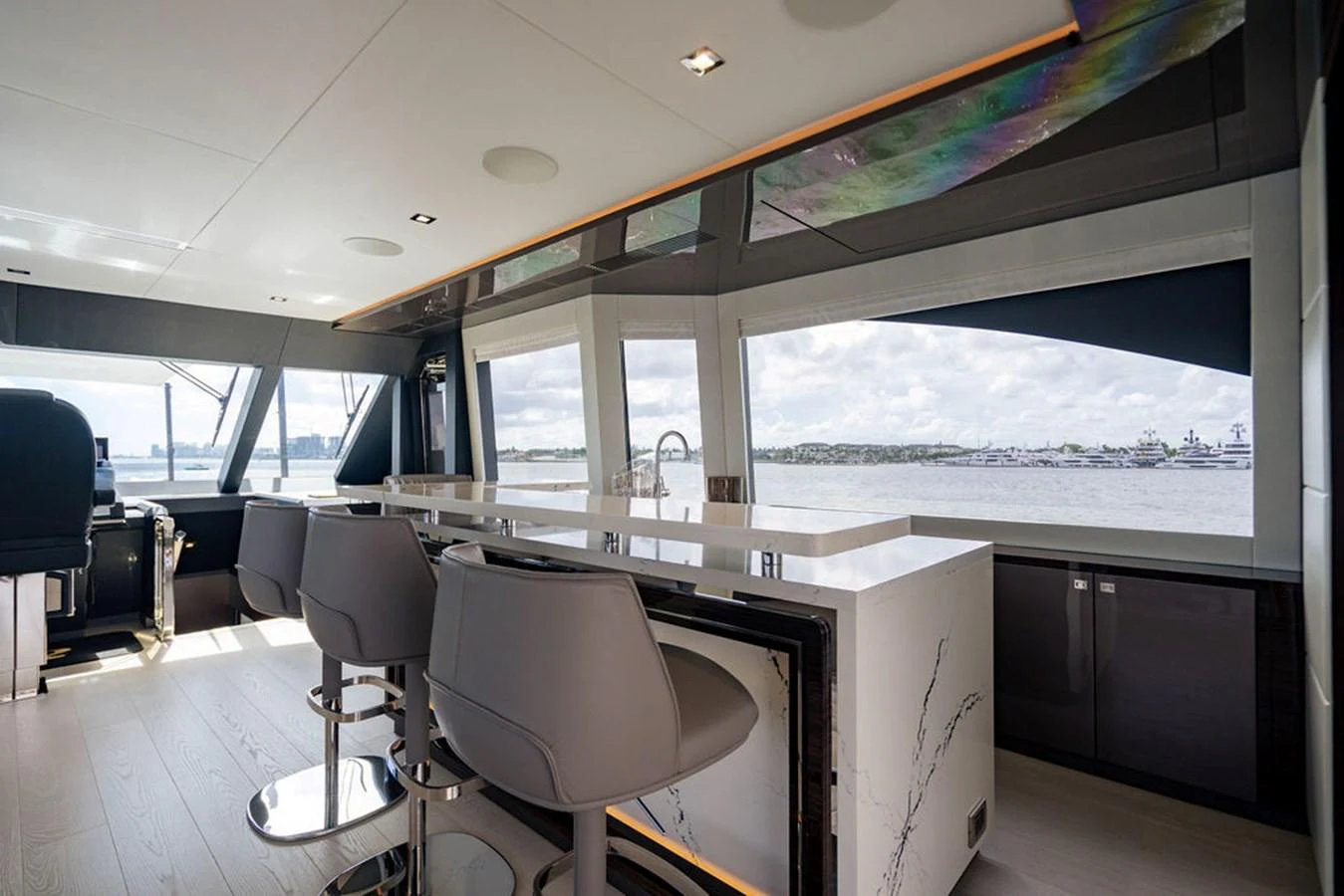 The modern galley features sleek design elements and offers stunning views through large windows. aboard M/Y 12 Yacht for Sale